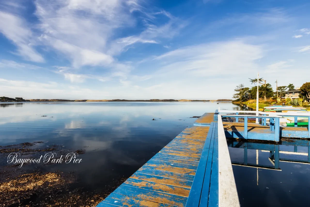 Baywood Park Pier with calm bay water and blue sky